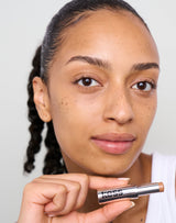 medium-to-tan; Trace wears the Concealer in Medium to Tan