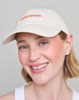 ; Jennifer wears the Limited Edition Cap