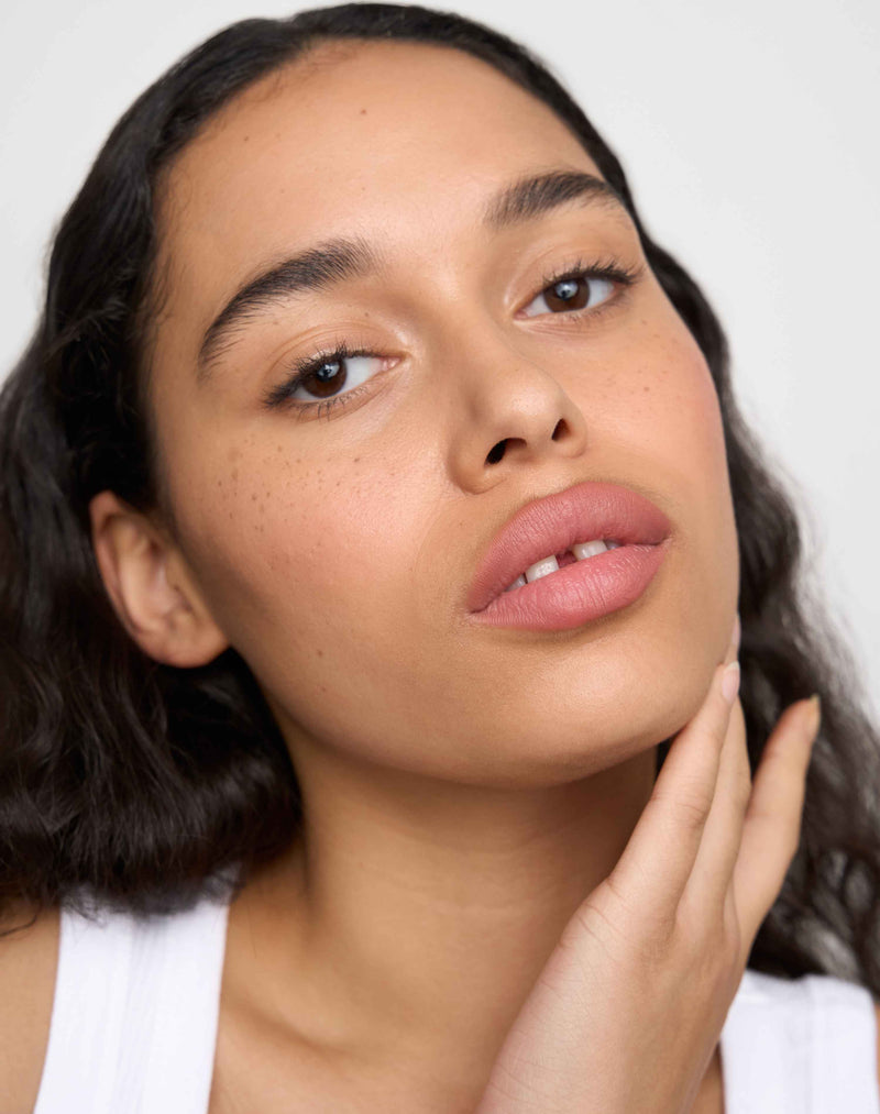 rosy nude; Louisa wears the Soft Shape Lip Liner in Rosy Nude