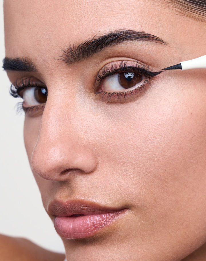 liquid-eyeliner; deep black: Naomi wears the Liquid Eyeliner in Deep Black