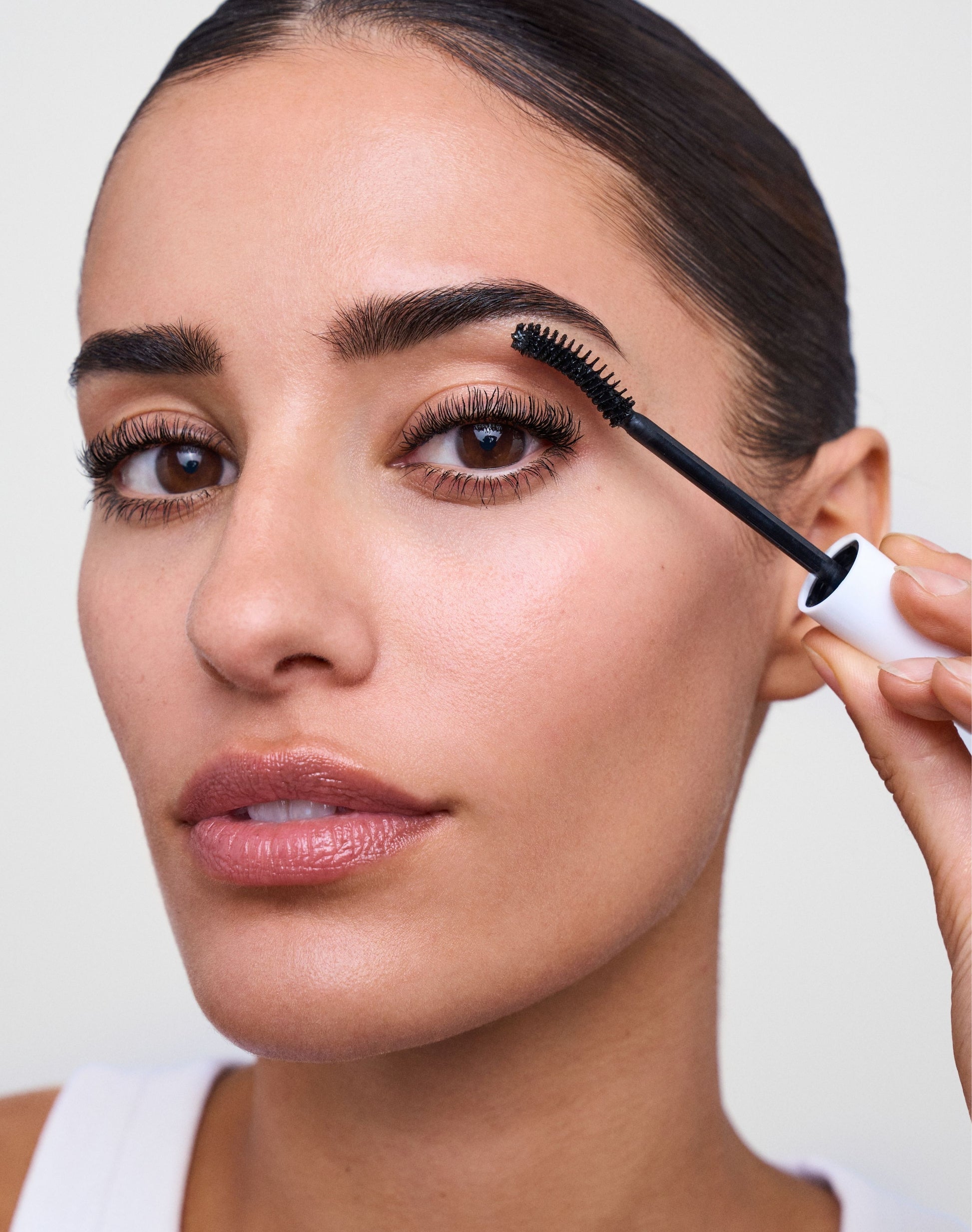 get-wet-waterproof-mascara; black: Naomi wears the GET WET Waterproof Mascara in Black