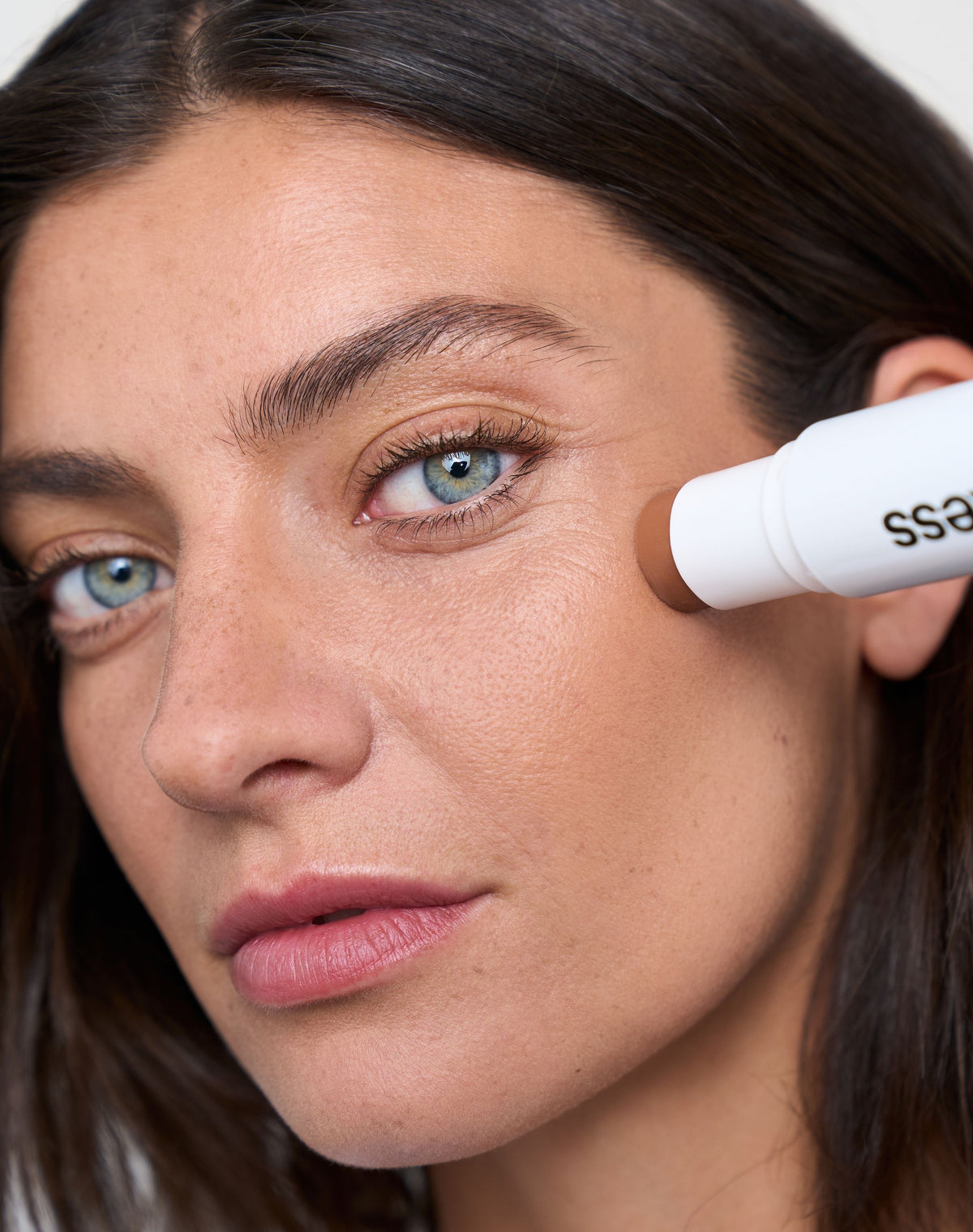 duo-stick; medium-bronzer: Melina wears the Cream Bronzer in Medium