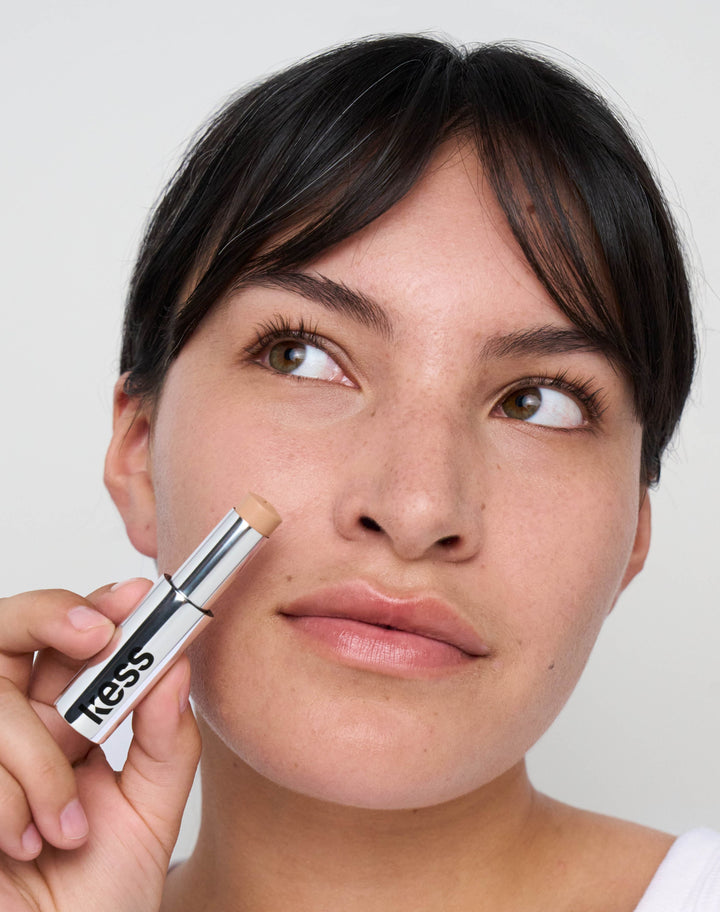 concealer-stick-spf-20; medium-1: Maya wears the Concealer in Medium 1