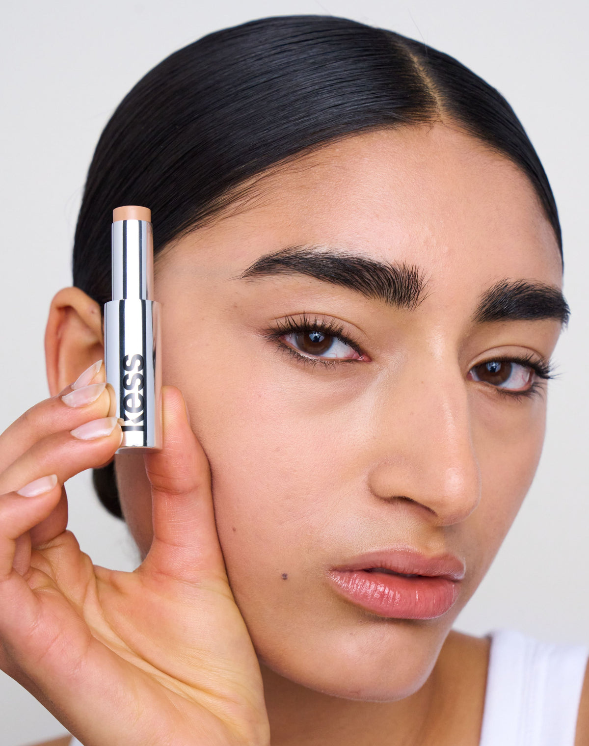 concealer-stick-spf-20; medium-2: Aya wears the Concealer in Medium 2
