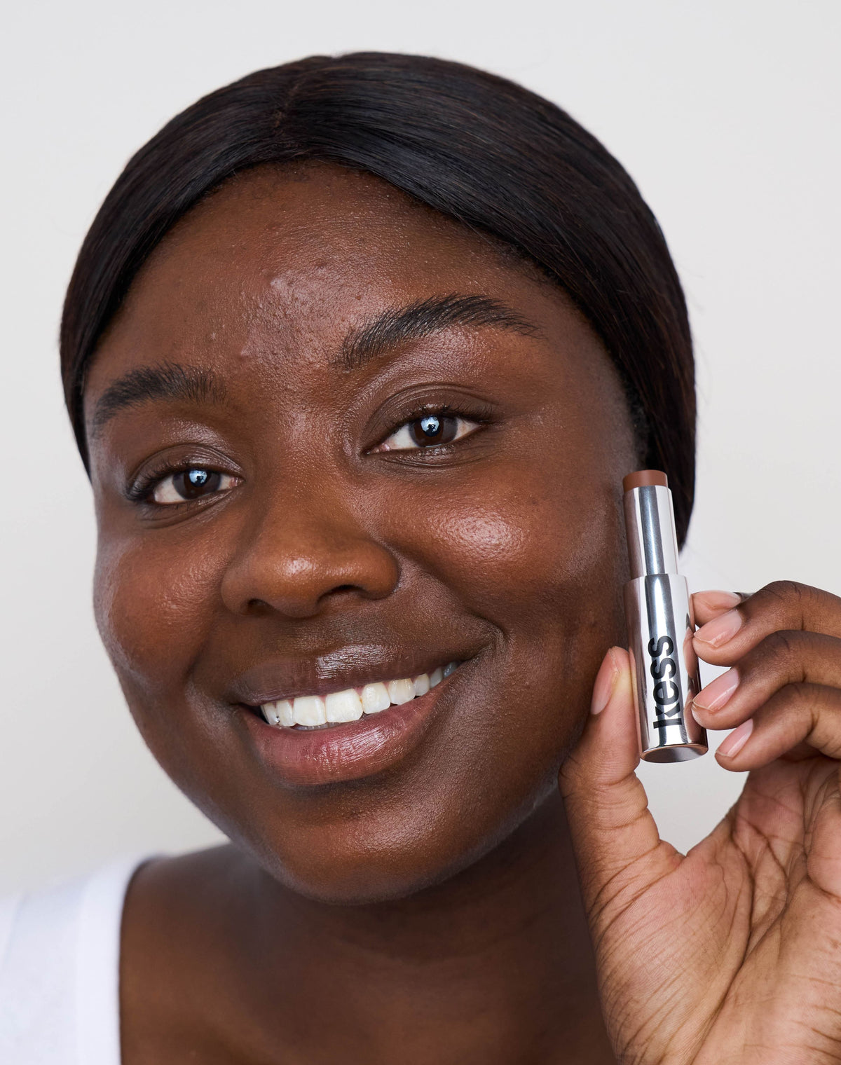 concealer-stick-spf-20; deep-1: Emma wears the Concealer in Deep 1
