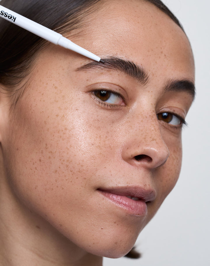 easy-brow-pencil; dark-brown: Natalia wears the Easy Brow Pencil in Dark Brown