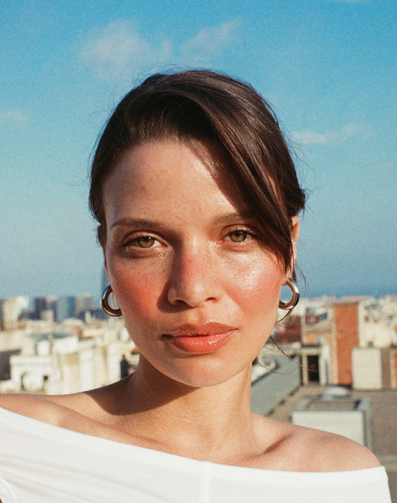 ; Stella wears the limited-edition blush shades in Melon and Toasted