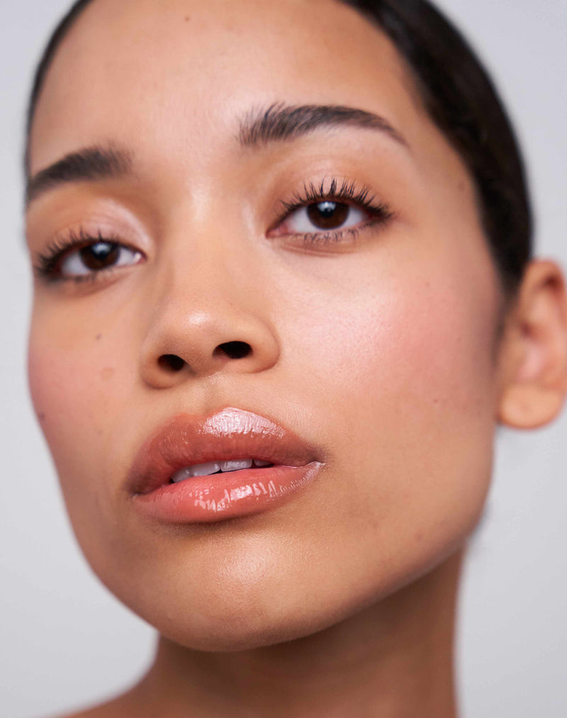 ; Celine wears the Soft Shape Lip Liner in Caramel Nude + Jelly Treat Lip Oil in Juice