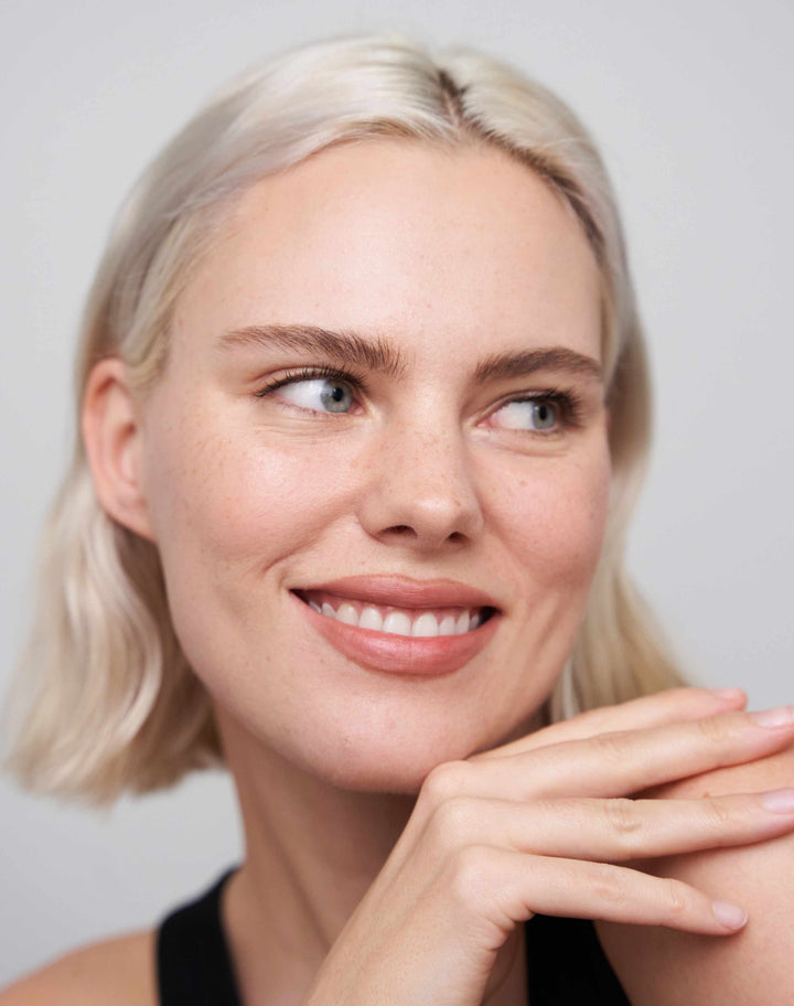 soft-shape-lip-liner; neutral-brown: Julia wears the Soft Shape Lip Liner in Neutral Brown and the Lipstick in Warm Nude