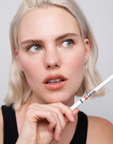 ; Julia wears the lip liner in the color Caramel Nude