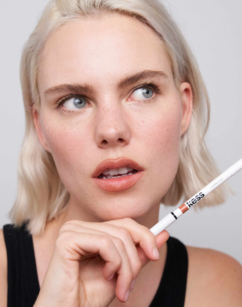 ; Julia wears the lip liner in the color Caramel Nude