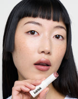 Naked; Loo Loo wears the Triple Tint Lip Balm in Naked