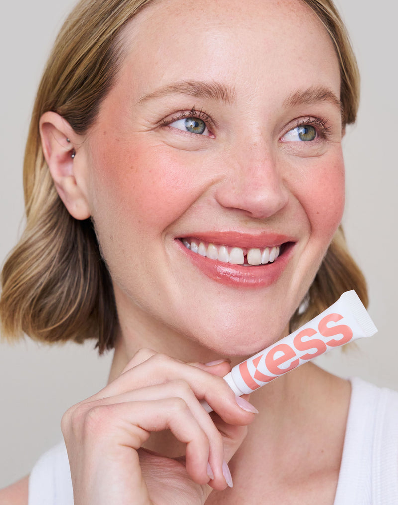 warm-sands; Jennifer wears the limited edition SPF Lip Gloss in Warm Sands