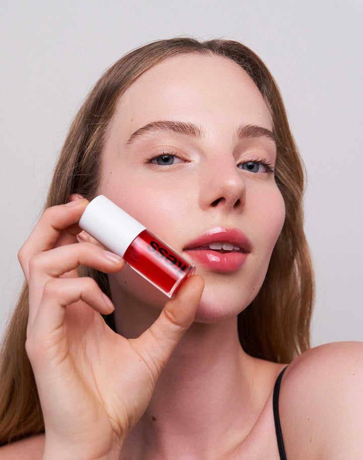 jelly-treat-lip-oil; drip: Paula wears the Jelly Treat Lip Oil in Drip
