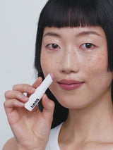 Nudie; Loo Loo wears the Triple Tint Lip Balm in Nudie