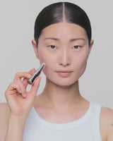 light-1; SaeHee inserts the refill into the case until it clicks into place - she wears shade Light 1