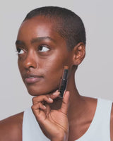 tan-2; Rim inserts the refill into the case until it clicks into place - she wears shade Tan 2