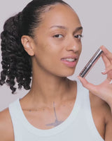 medium-to-tan; Trace inserts the refill into the case until it clicks into place - she wears shade Medium to Tan